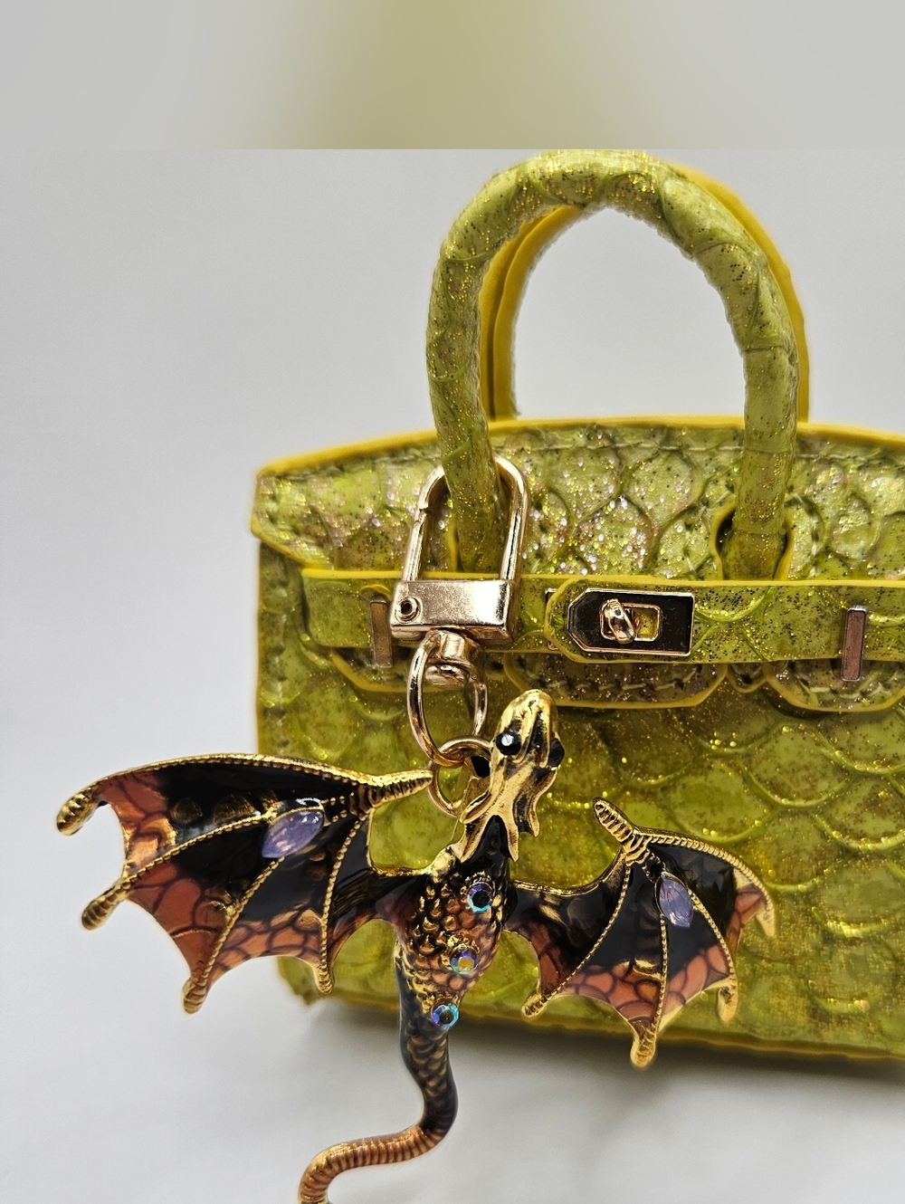 Yellow Glitter Mini Bag with Dragon Charm. Fish Leather. Bag Opens.